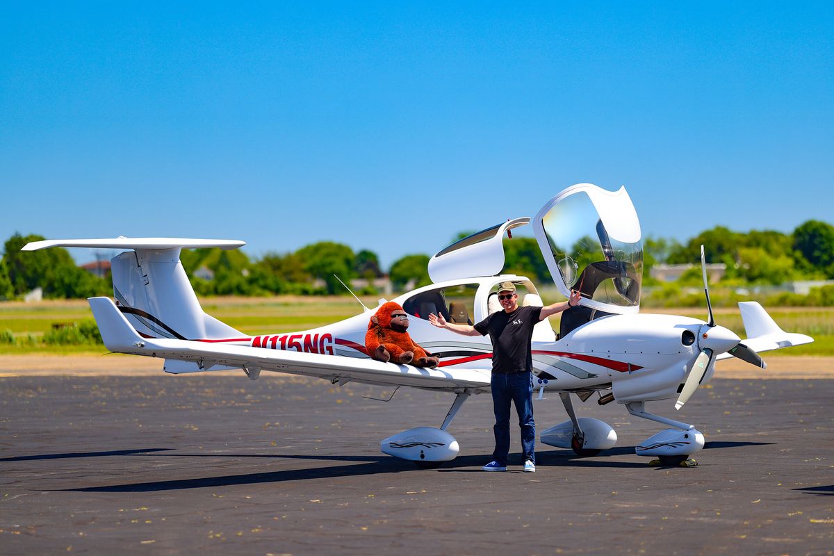 Owner standing with N115NG on the ramp